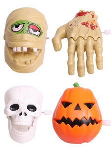 Detail shot of wind-up Halloween toys including mummy, zombie, skull and pumpkin characters