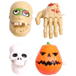 Wind-up Halloween toy set featuring pumpkin, skull, mummy head, and bloody hand figures