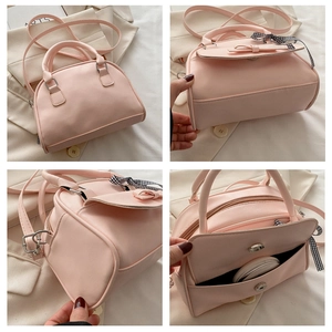 Detailed views of pink bow handbag featuring magnetic closure and side ribbon accent