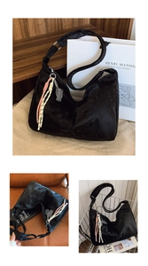 Detail of glossy black nylon tote bag with colorful braided charms and a tennis racket pendant