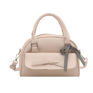 Fashionable pale pink shell-shaped tote bag with ribbon bow and adjustable shoulder strap