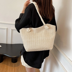 Woven straw tote bag with herringbone texture and thick cotton rope shoulder straps