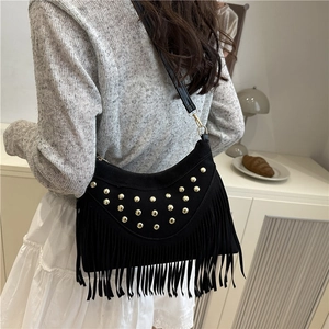 Black frosted suede shoulder bag with gold rivets and bohemian fringe styling