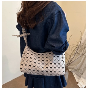 Detailed shoulder view of a plaid tote bag featuring a decorative bow knot and large capacity
