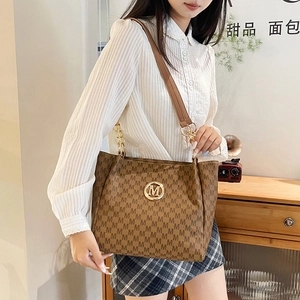 Classic brown monogram tote bag with gold M logo and leather chain shoulder strap