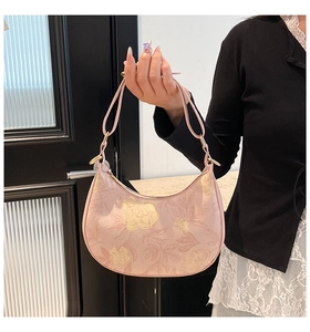 Close-up of pink floral Hobo bag with delicate texture and metal ring detail