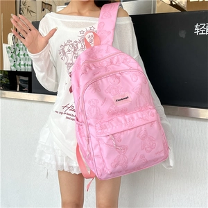 Vue détaillée du sac à dos rose pour étudiant avec motifs ours et étiquette en cuir