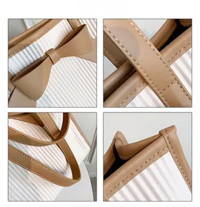 Detailed views of the pleated tote bag showing bow accent, stitching and leather handles