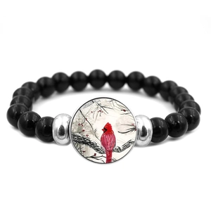 Bracciale elastico con perline nere e ciondolo con uccello cardinale rosso