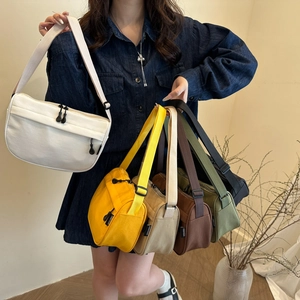 Minimalist nylon crossbody bag for women with adjustable strap and front zipper pocket