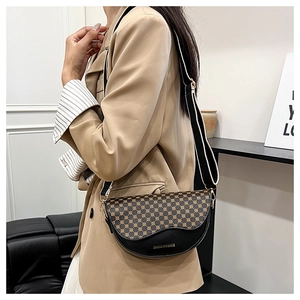 Detail of checkered flap crossbody bag with adjustable wide strap and gold logo