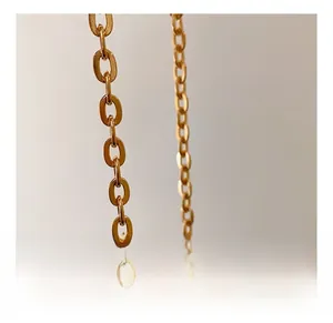 Close-up of premium champagne gold hardware chain with elegant oval metal links
