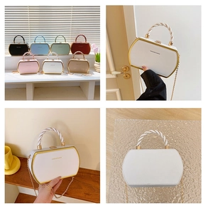 Multiple colors of structured crossbody box bags with gold frames and twisted top handles