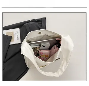 Top view showing the large capacity and magnetic closure of the white PU leather tote bag