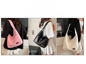 Detailed view of large Hobo shoulder bag in pink, black, and white soft PU leather