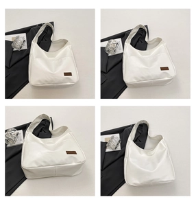 Detailed views of a minimalist white leather tote bag with a small brown logo patch