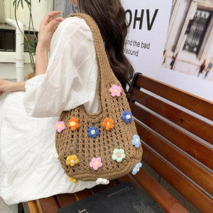 Brown knit tote bag with colorful 3D flowers and hollow crochet design for summer