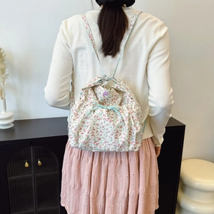 Fresh floral drawstring backpack with pink and blue patterns for women's daily use
