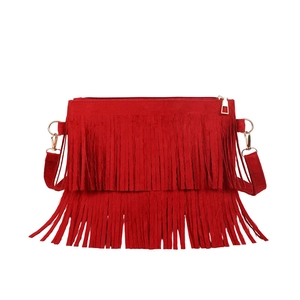 Red bohemian fringe crossbody bag with suede finish and golden hardware details