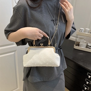 White vintage shell handbag with embossed fabric and gold metal chain strap for women
