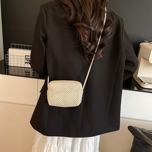 Minimalist beige handmade woven mini crossbody bag for women with natural texture