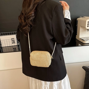 Mini handmade straw woven crossbody bag for women with minimalist summer aesthetic