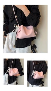 Detail of pink pleated cloud bag with pearl strap and lace bow accent from various angles