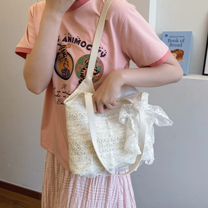 Elegante borsa tote in pizzo bianco con ricamo floreale e fiocco per l'estate