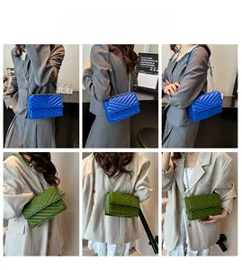 Quilted flap bag in royal blue and grass green with silver chain shoulder straps