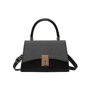 Chic contrast-color trapezoid handbag with grey fabric flap and golden twist lock
