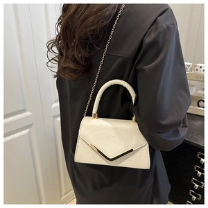 Chic white glitter crossbody bag with V-shaped gold metal trim and chain strap