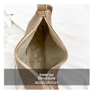 Detailed internal structure of brown woven dumpling bag with secure zipper closure