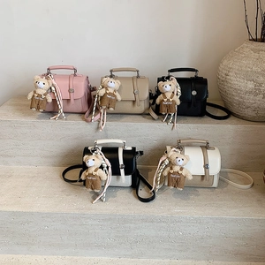 Fashionable PU leather crossbody bags in five colors with cute teddy bear pendants