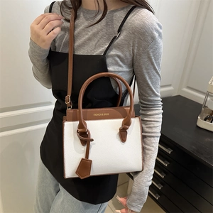 Minimalist white and brown patchwork crossbody bag with gold Fashion & Bags lettering