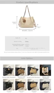 Detail of large PU leather tote bag showing detachable woven strap and bear pendant