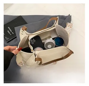 Interior view of cream faux leather tote bag showing spacious capacity for cosmetics