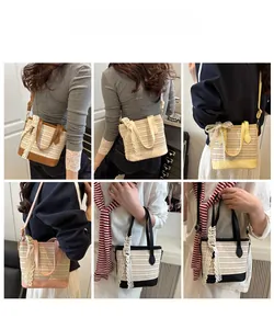 Multiple colors of woven straw bucket bags with lace bows shown on a model