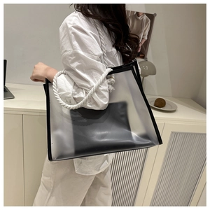 Detail of clear frosted PVC tote bag with thick cotton rope handles and black inner pouch