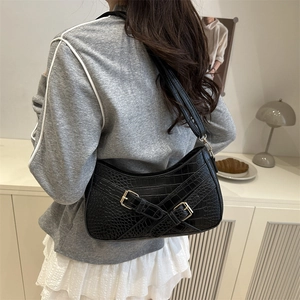 Minimalist black croc-embossed shoulder bag with golden buckles for women