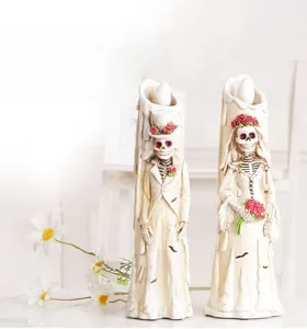 Detail of Halloween skeleton bride and groom LED candle lights with realistic drip effect