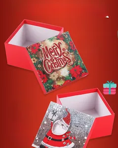Macro detail of red Christmas gift boxes with festive Merry Christmas lettering and Santa