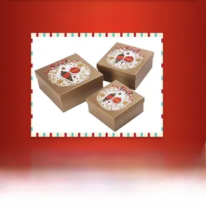 Three-piece bronze Christmas gift box set with snowflake patterns and festive decorations