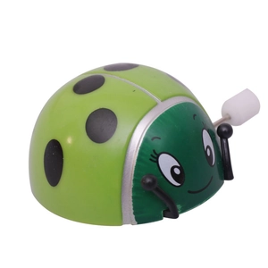 Green wind-up ladybug toy with mechanical clockwork and cute smiley face design