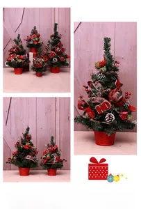 Mini Christmas tree detail with red berries, pinecones, and 'HO' wooden signs in pots