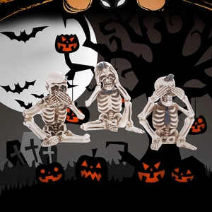 Three Halloween skeleton figurines set in See-Hear-Speak No Evil poses for party decor