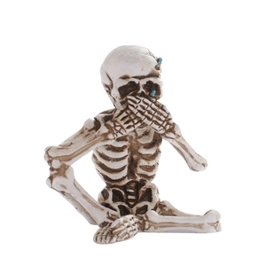 Halloween resin skeleton figurine in speak-no-evil pose with vintage bone finish