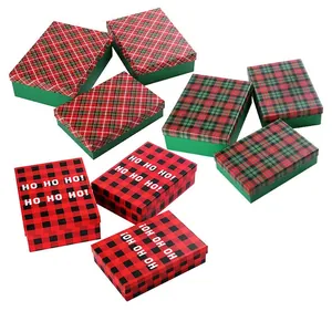 Christmas gift boxes in red and green buffalo plaid with HO HO HO festive patterns