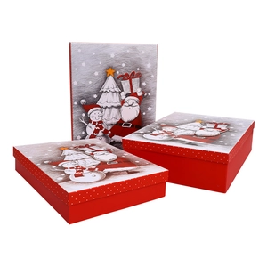 Three-piece red Christmas gift box set with Santa Claus illustrations and white polka dots