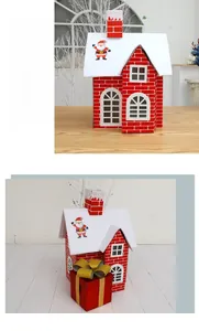 Macro view of Christmas house gift box featuring red brick patterns and snowy roof