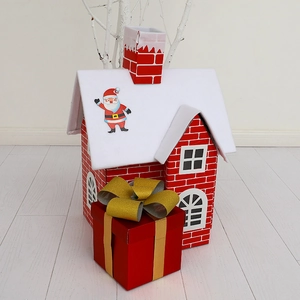Christmas cottage and red gift box set for festive holiday home and hotel decoration